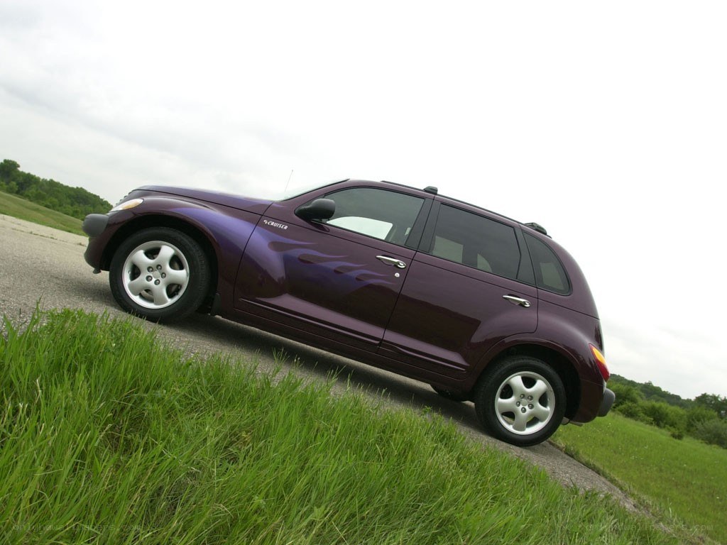 Purple PT Cruiser on a road