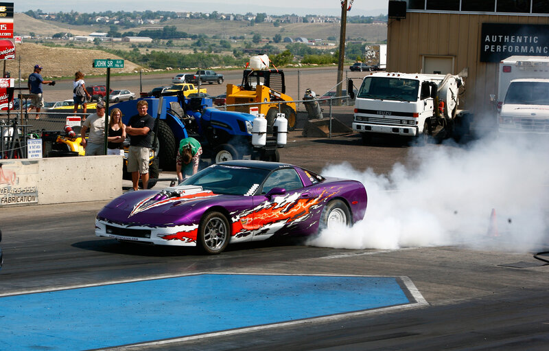 Purple Race Car Burning Tire
