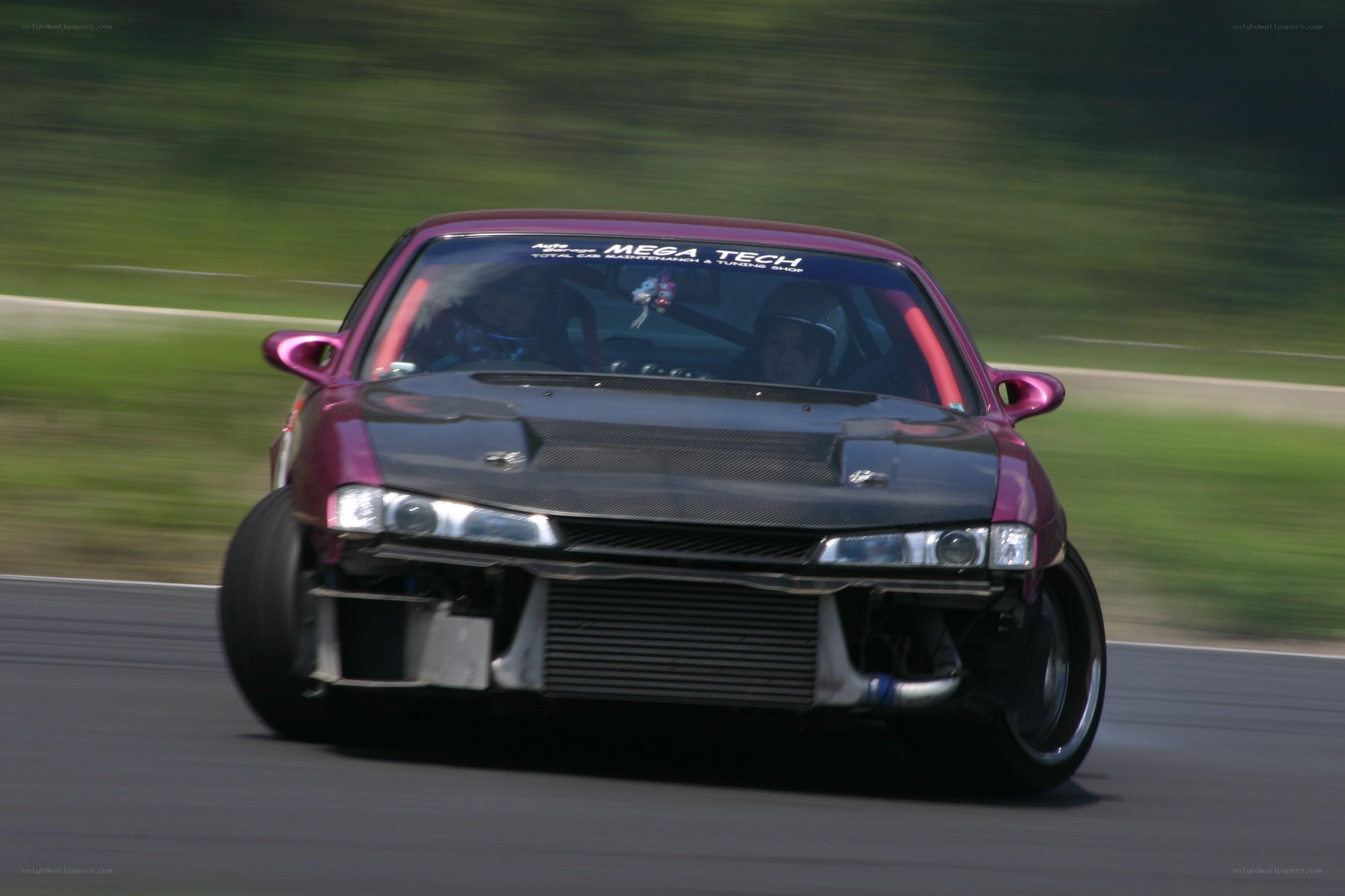 purple race car on track