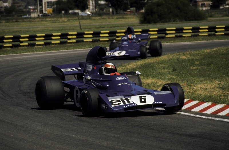 Purple racing cars on a track