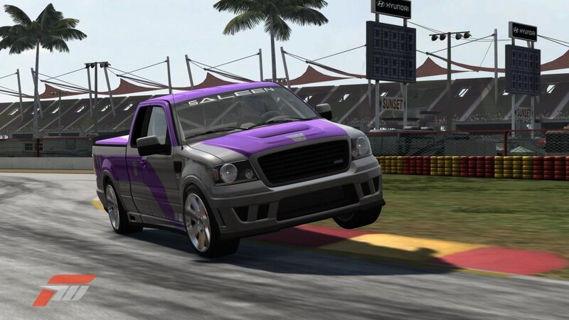 Purple racing truck on track