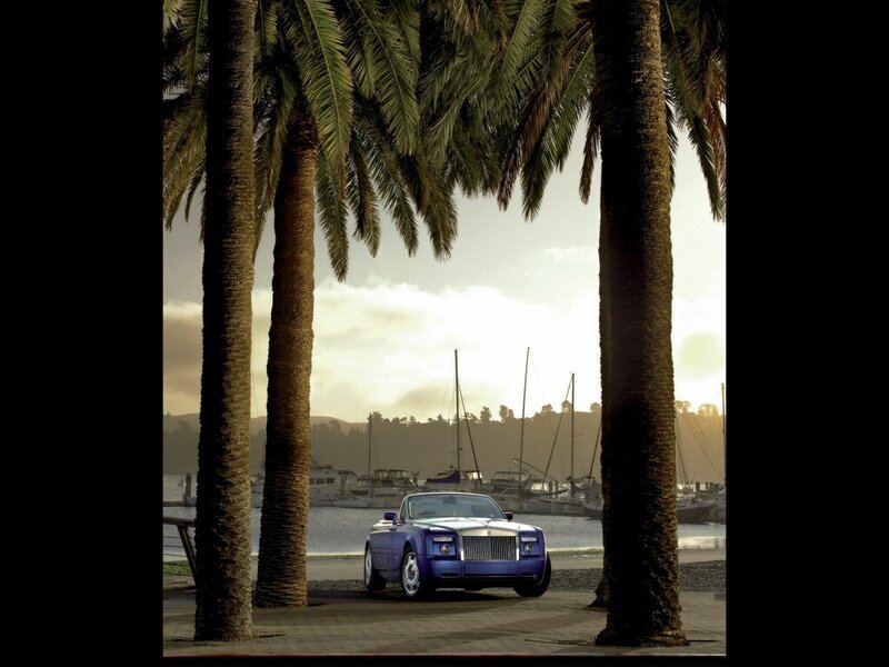 Purple Rolls-Royce by palm trees