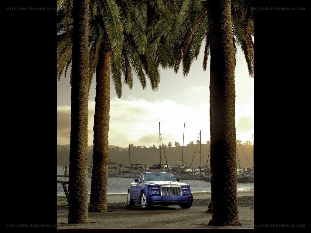 Purple Rolls-Royce by palm trees