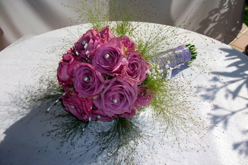 purple rose bouquet with pearls