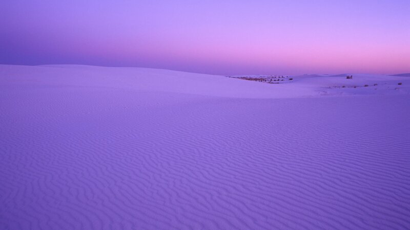 Purple sand dunes at dusk