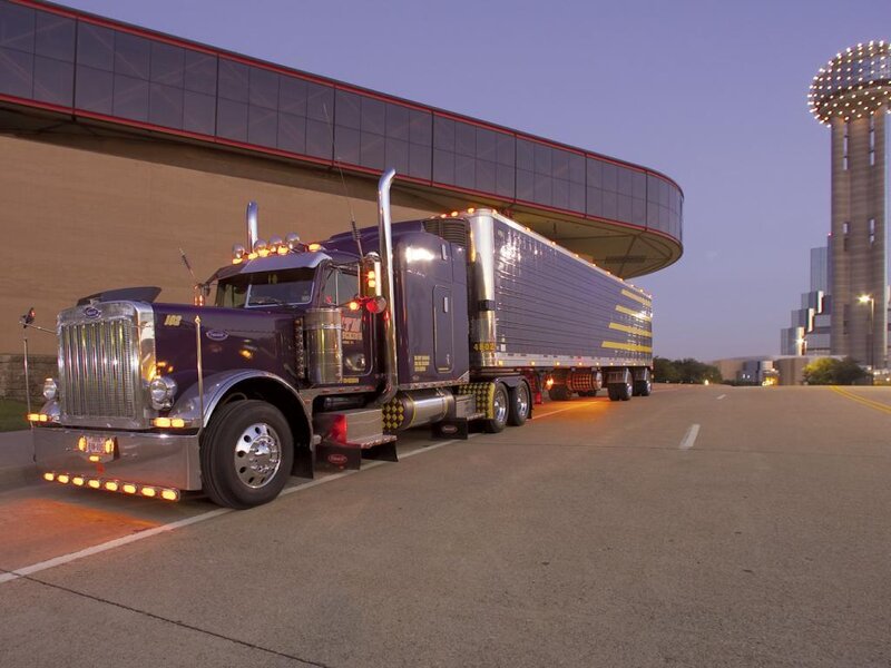 Purple semi-truck at dusk