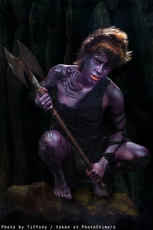 purple-skinned warrior with axe