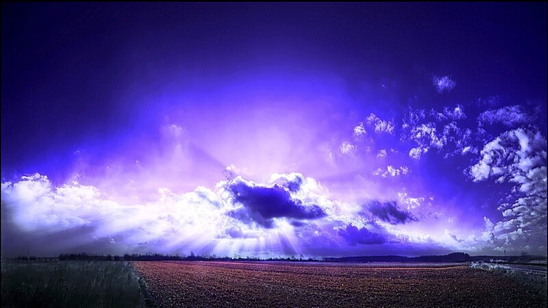 Purple sky over a field