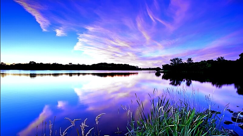 Purple sky over calm lake