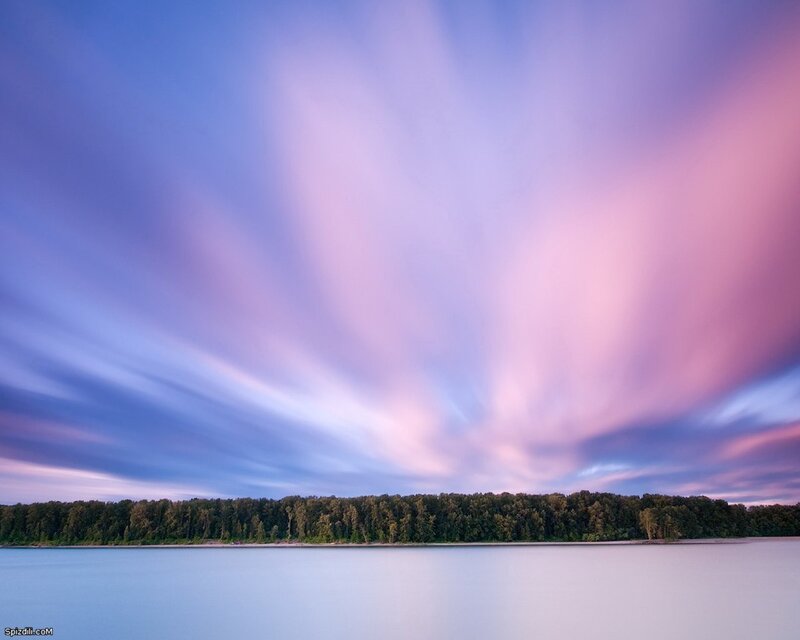 Purple sky over calm lake