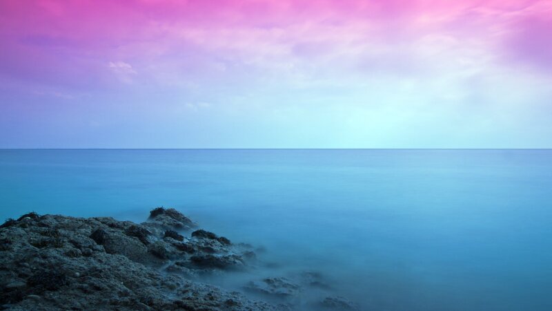 purple sky over calm sea