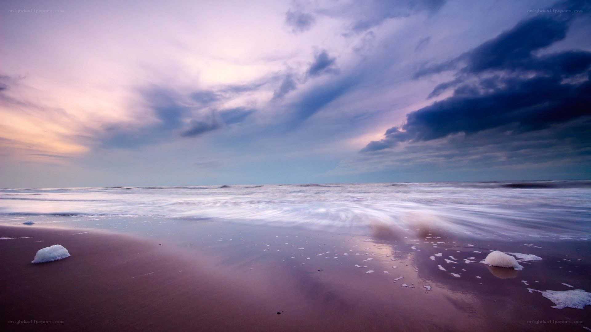 Purple sky over ocean beach