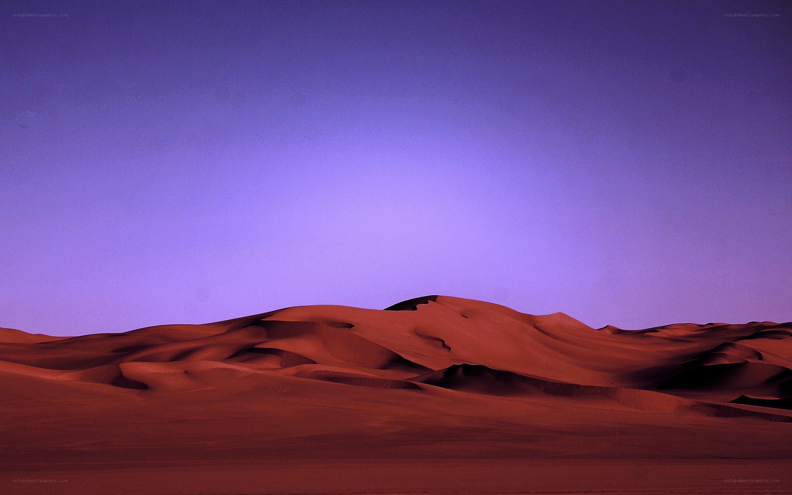 Purple sky over red dunes