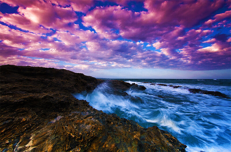 Purple Sky Over Rocky Coast