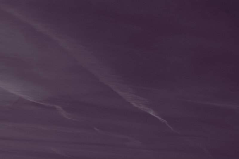 purple sky with wispy clouds
