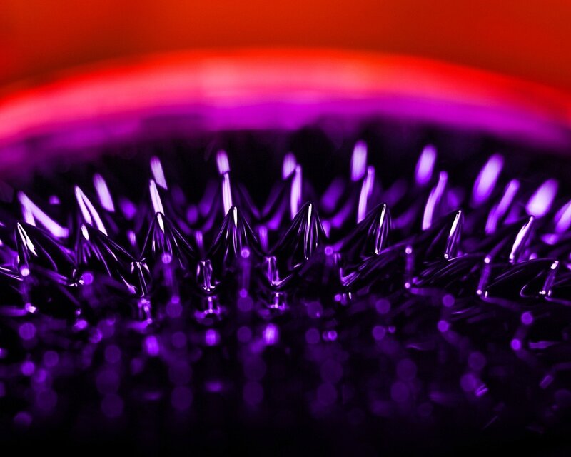 Purple spikes under red light