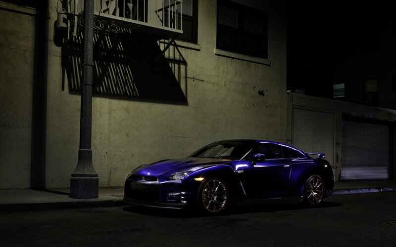 Purple sports car at night