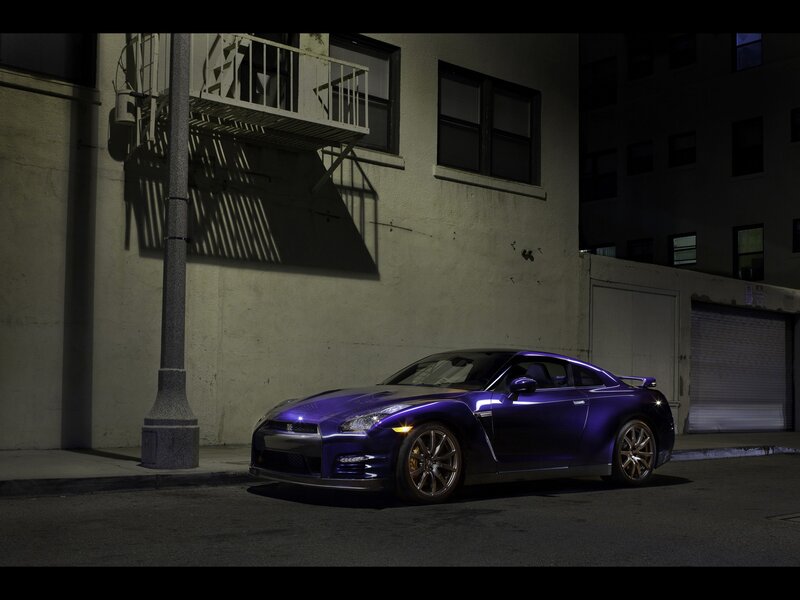 Purple sports car at night