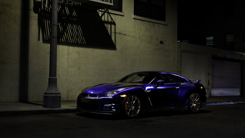 Purple sports car at night
