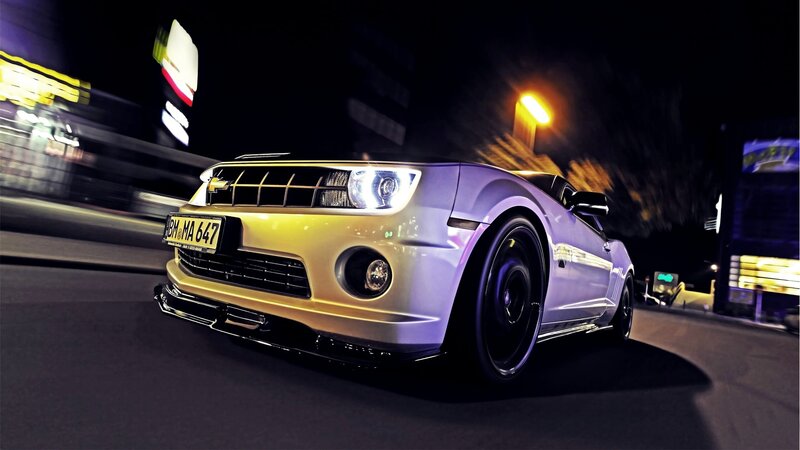 Purple sports car at night