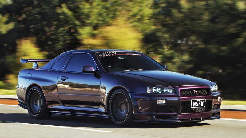 purple sports car in motion