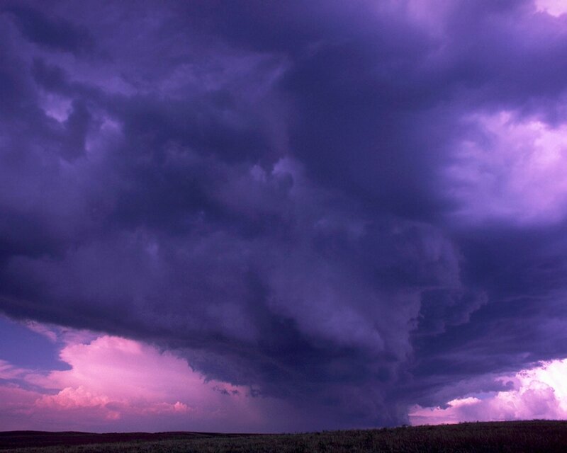 Purple storm clouds over plains