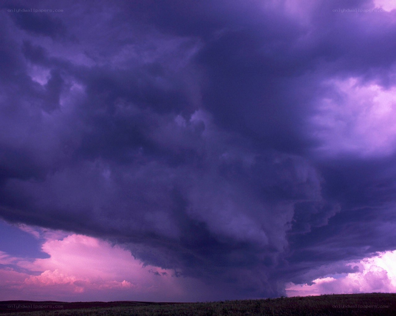 Purple storm clouds over plains