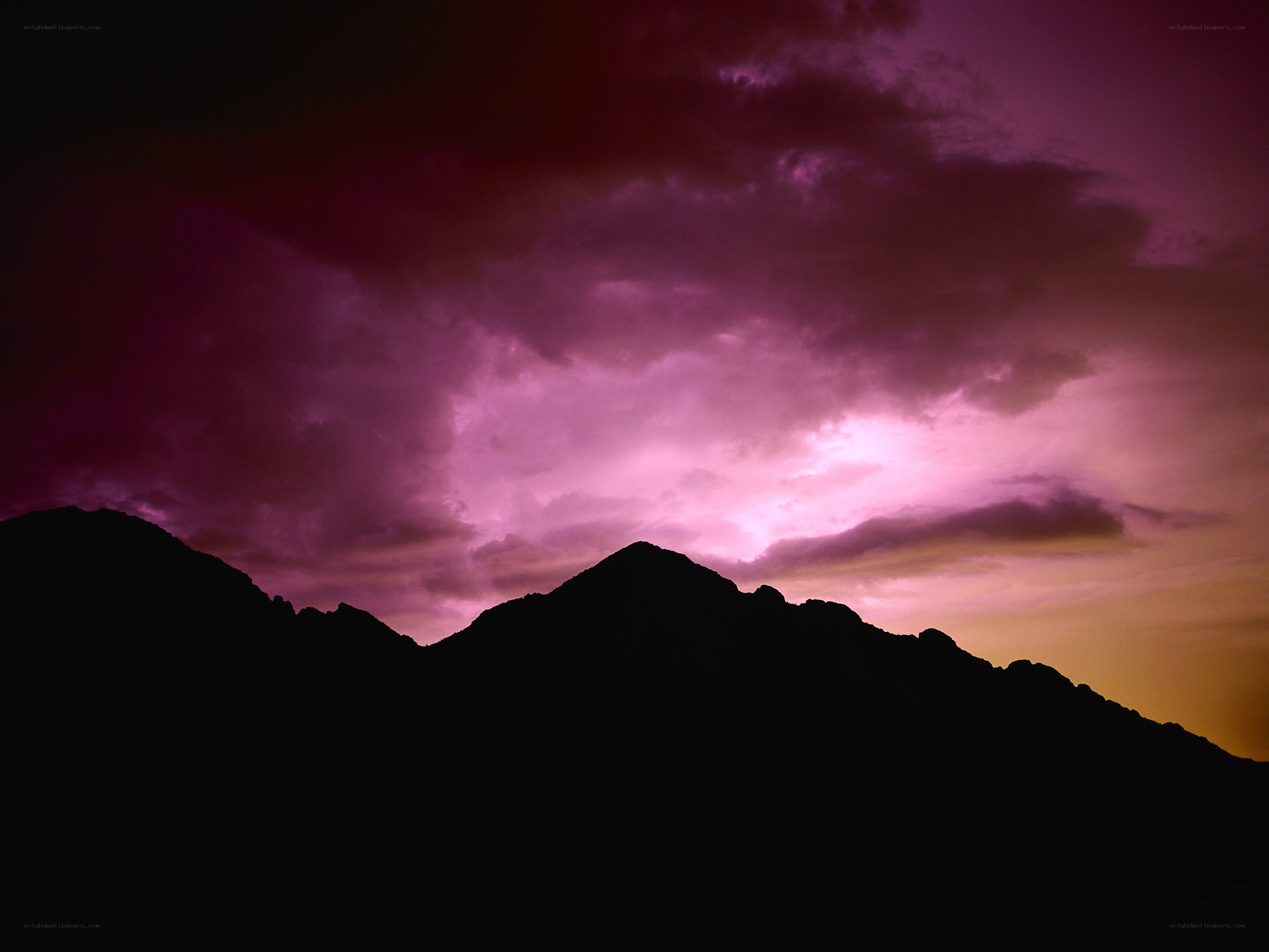 Purple storm over mountains
