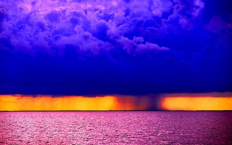 Purple storm over ocean