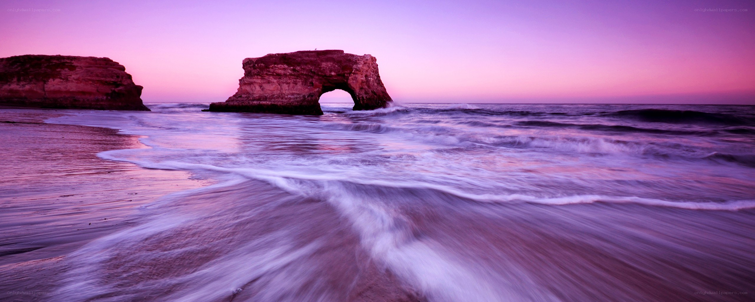 Purple sunset at natural arch