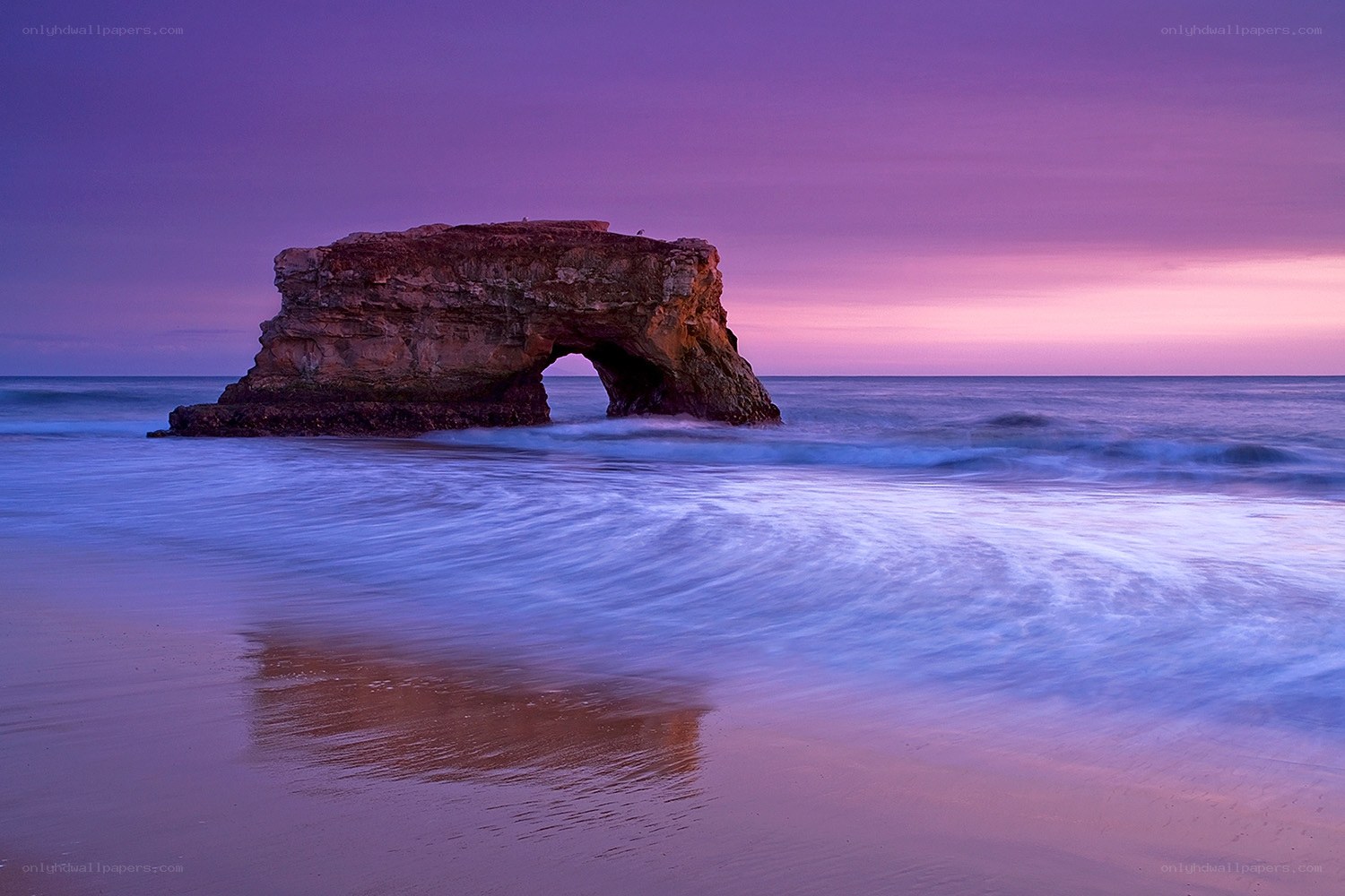 Purple sunset at natural arch