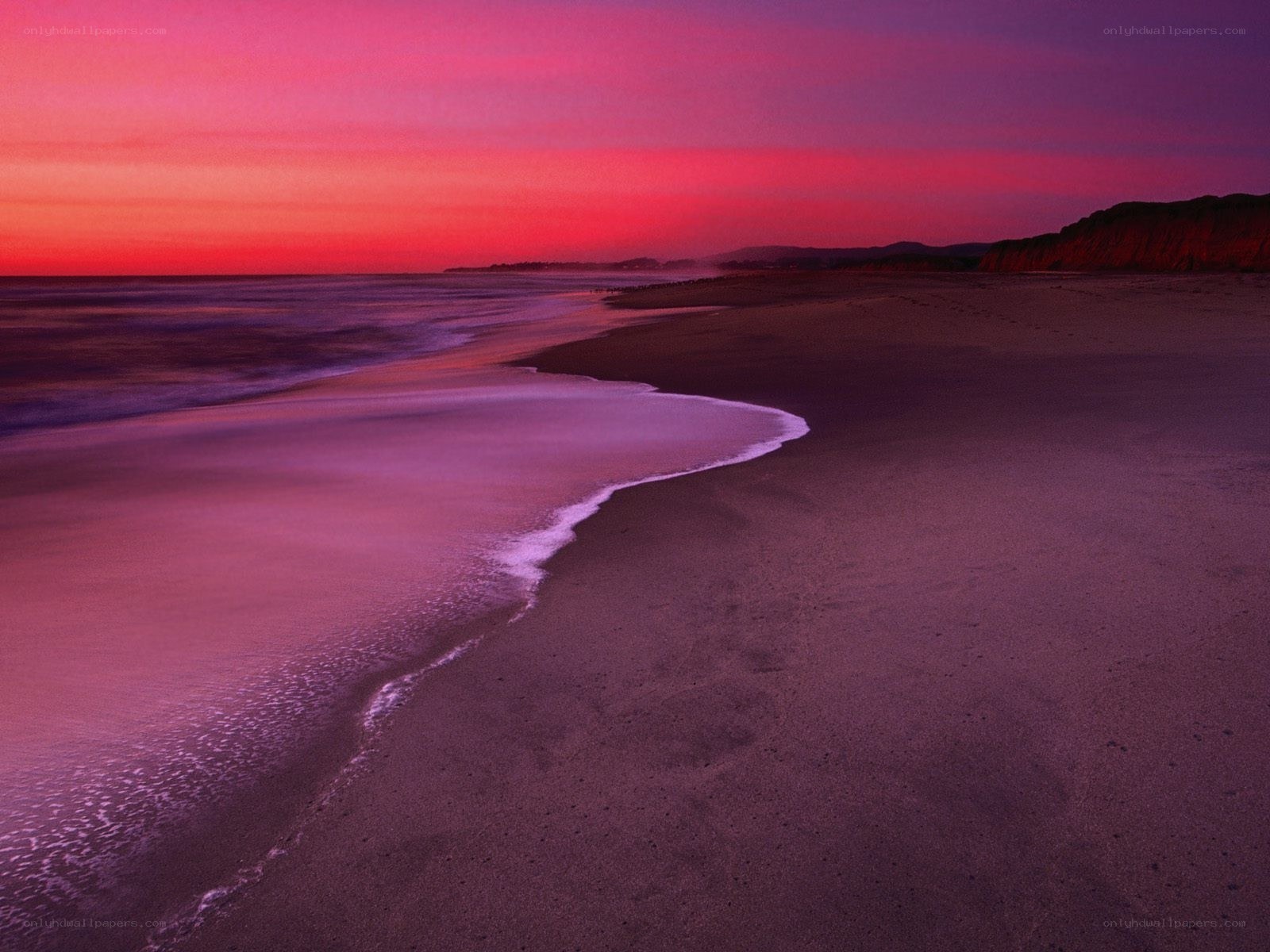 Purple sunset on a sandy beach
