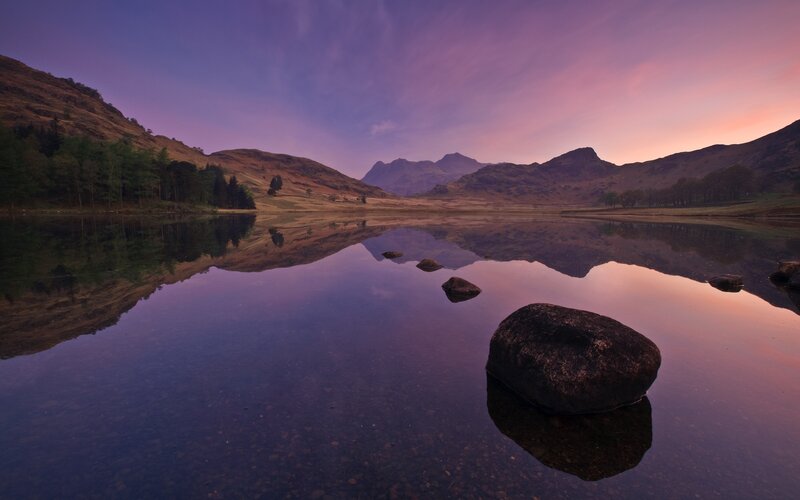 Purple sunset over a calm lake