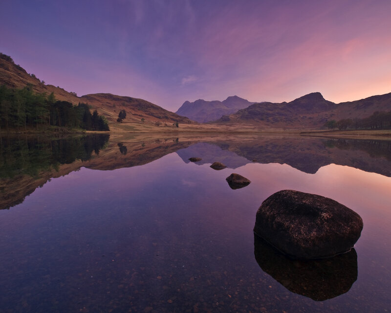Purple sunset over a calm lake