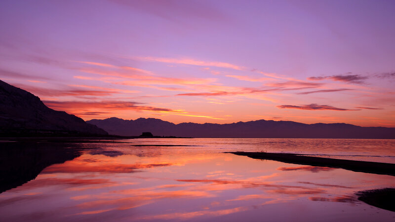 Purple sunset over a calm lake