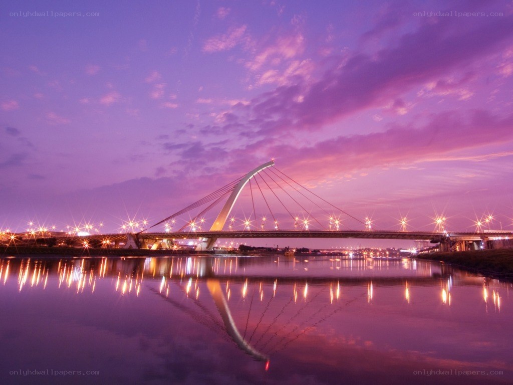 Purple sunset over a modern bridge