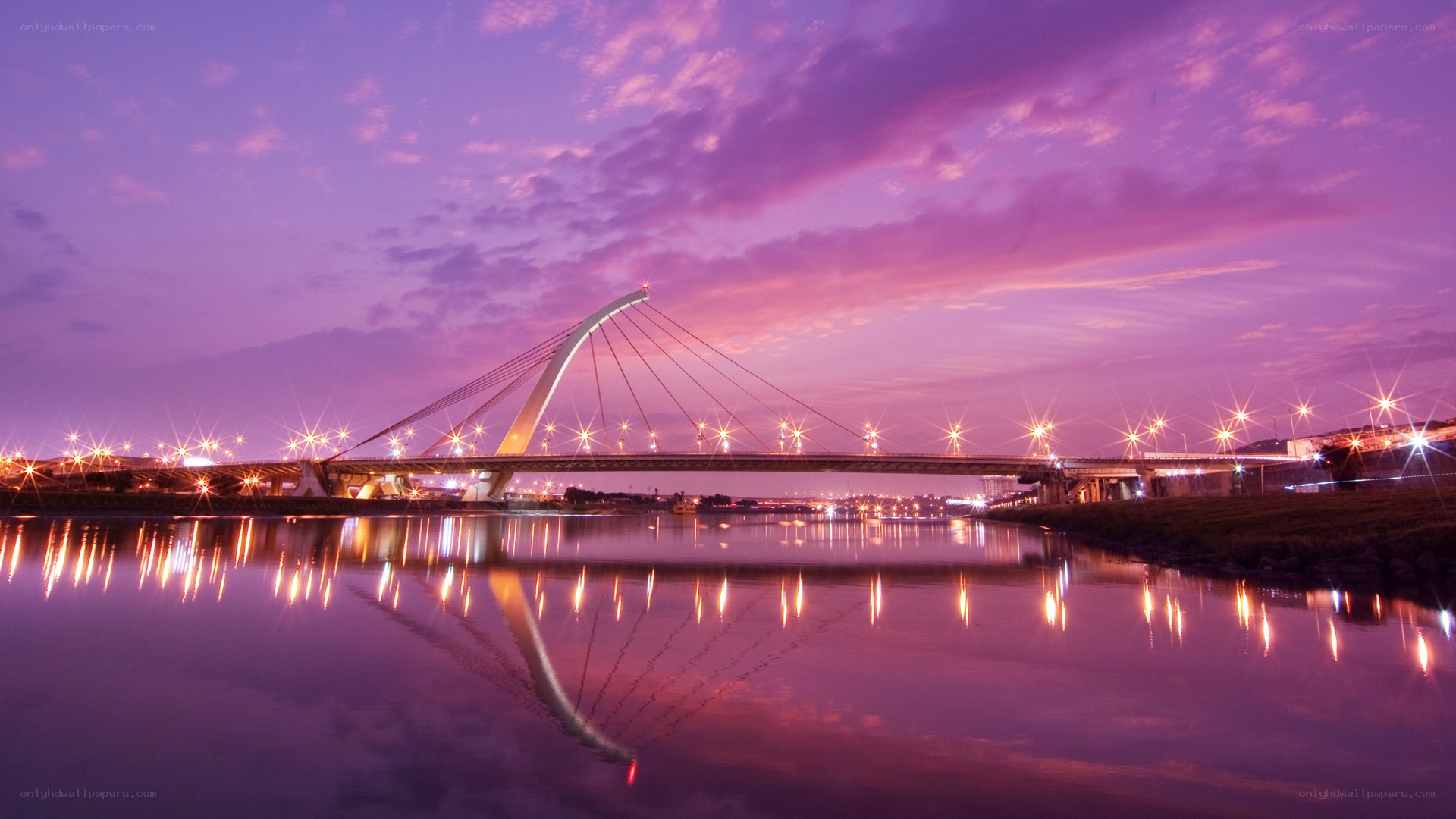 Purple sunset over a modern bridge