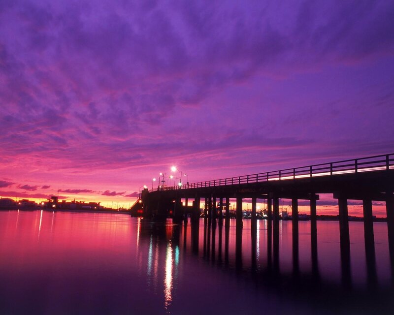 Purple sunset over a pier