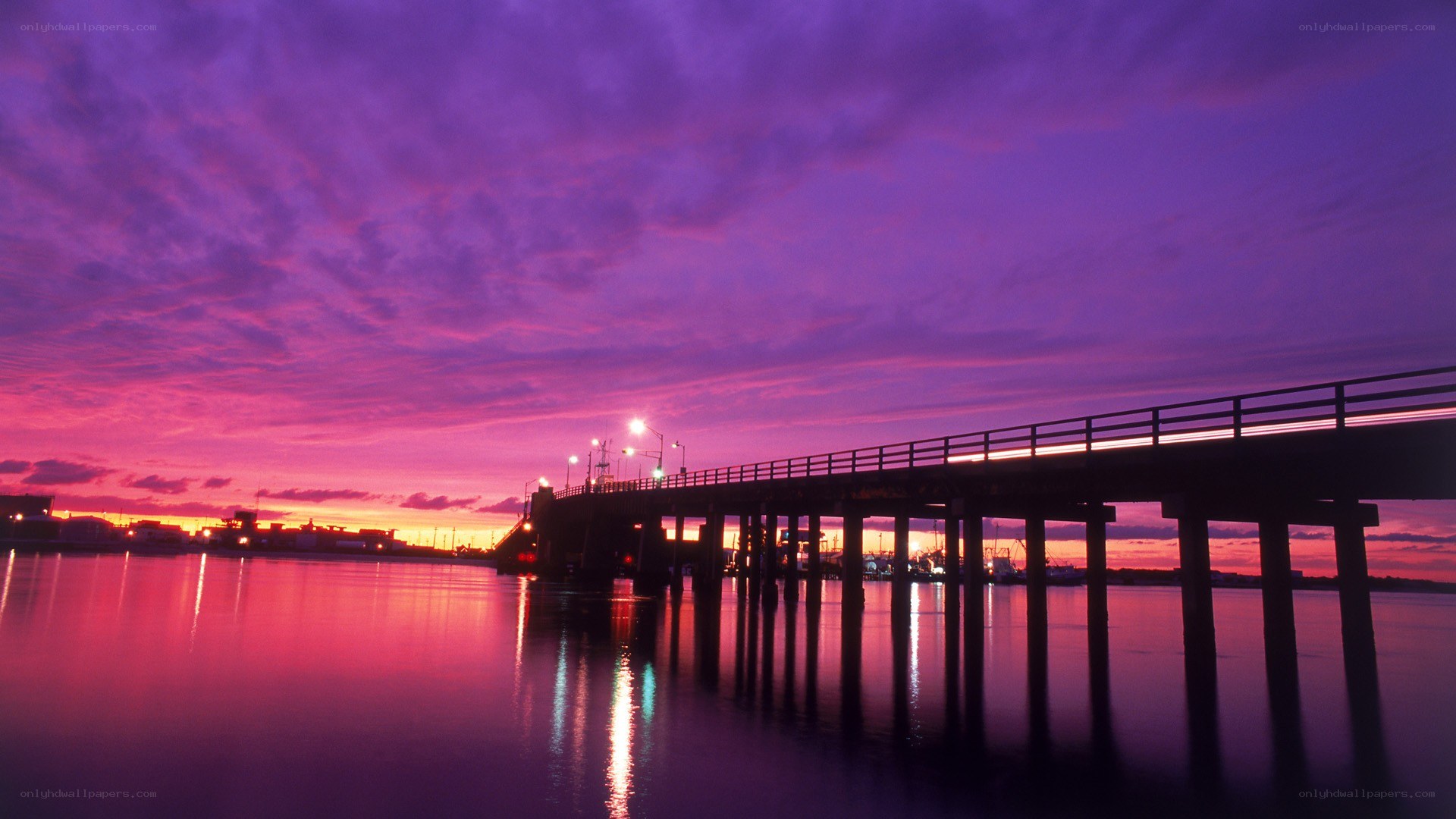 Purple sunset over a pier