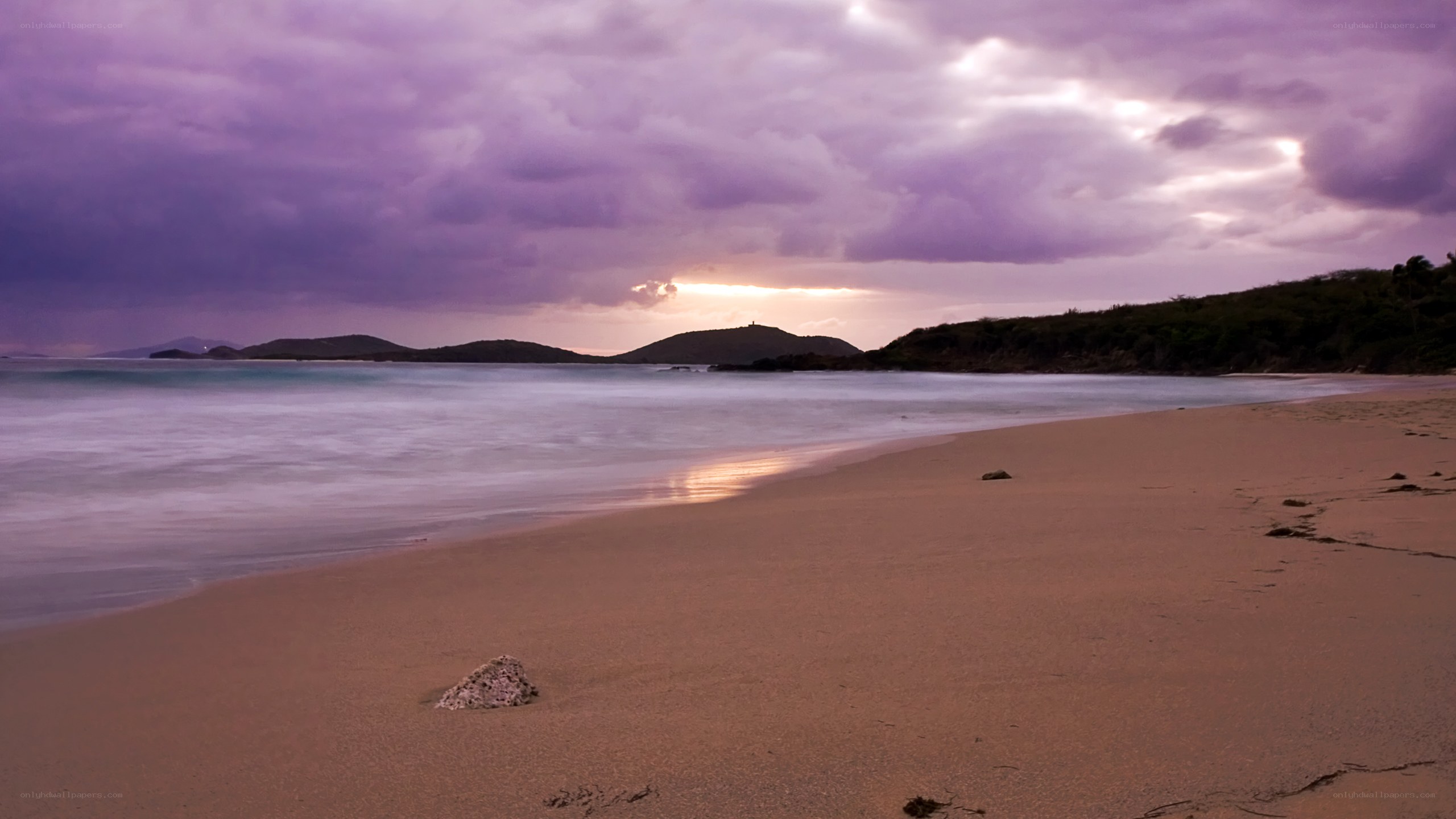 Purple sunset over a quiet beach