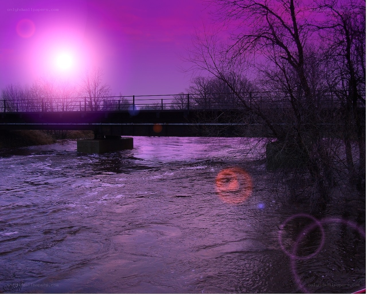 Purple sunset over a river bridge