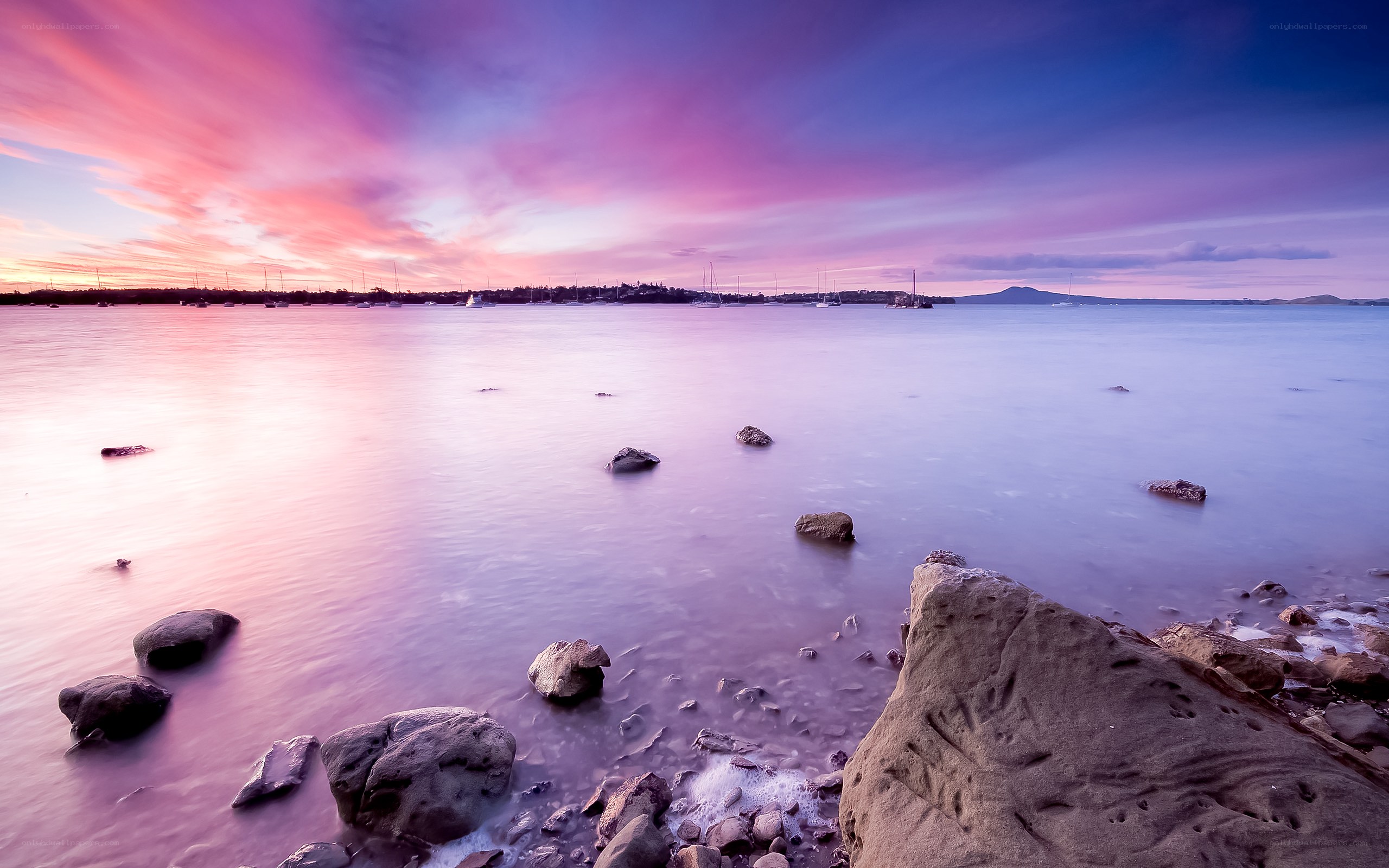 Purple sunset over calm bay