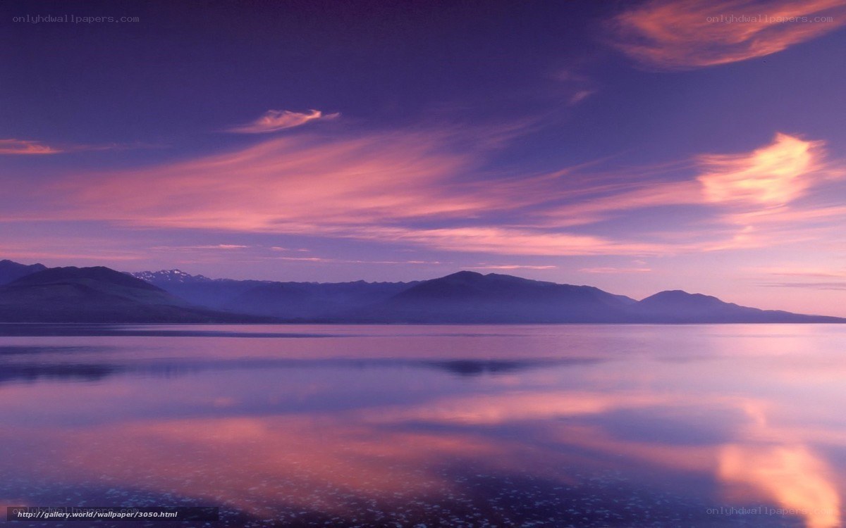 Purple sunset over calm lake