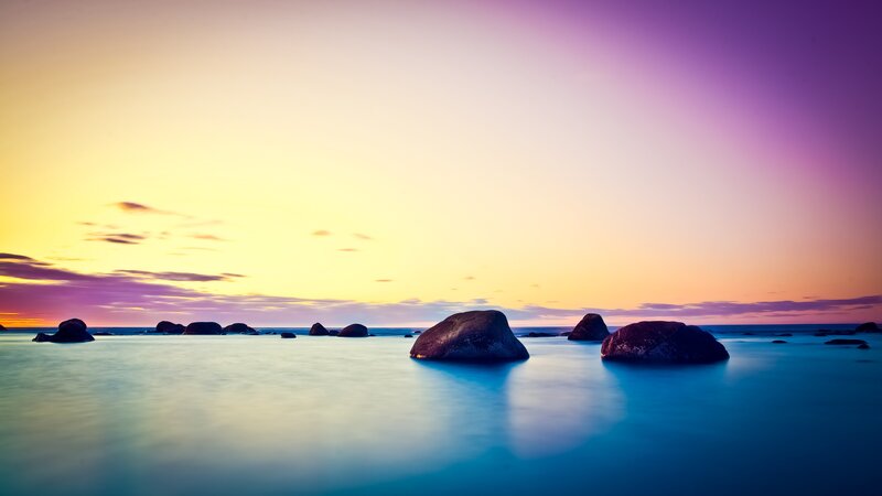 Purple sunset over calm sea