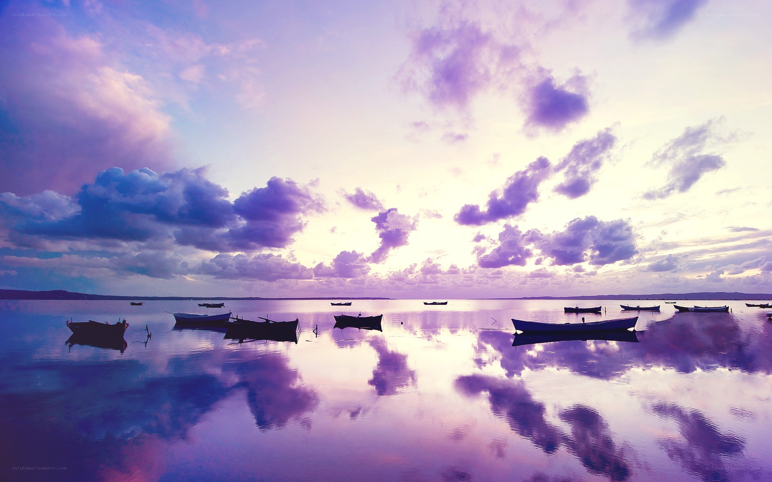 Purple sunset over calm water