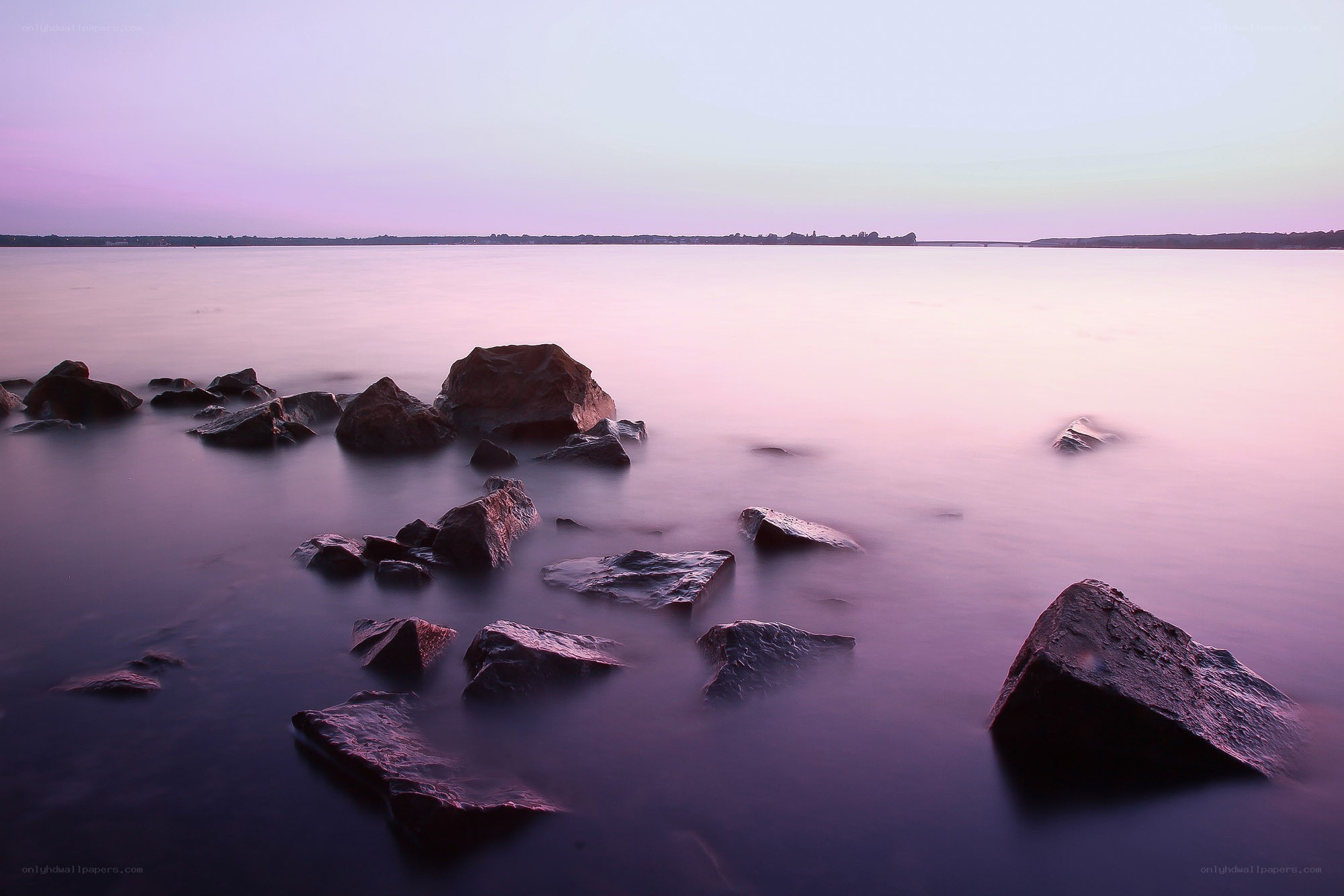 Purple sunset over calm water