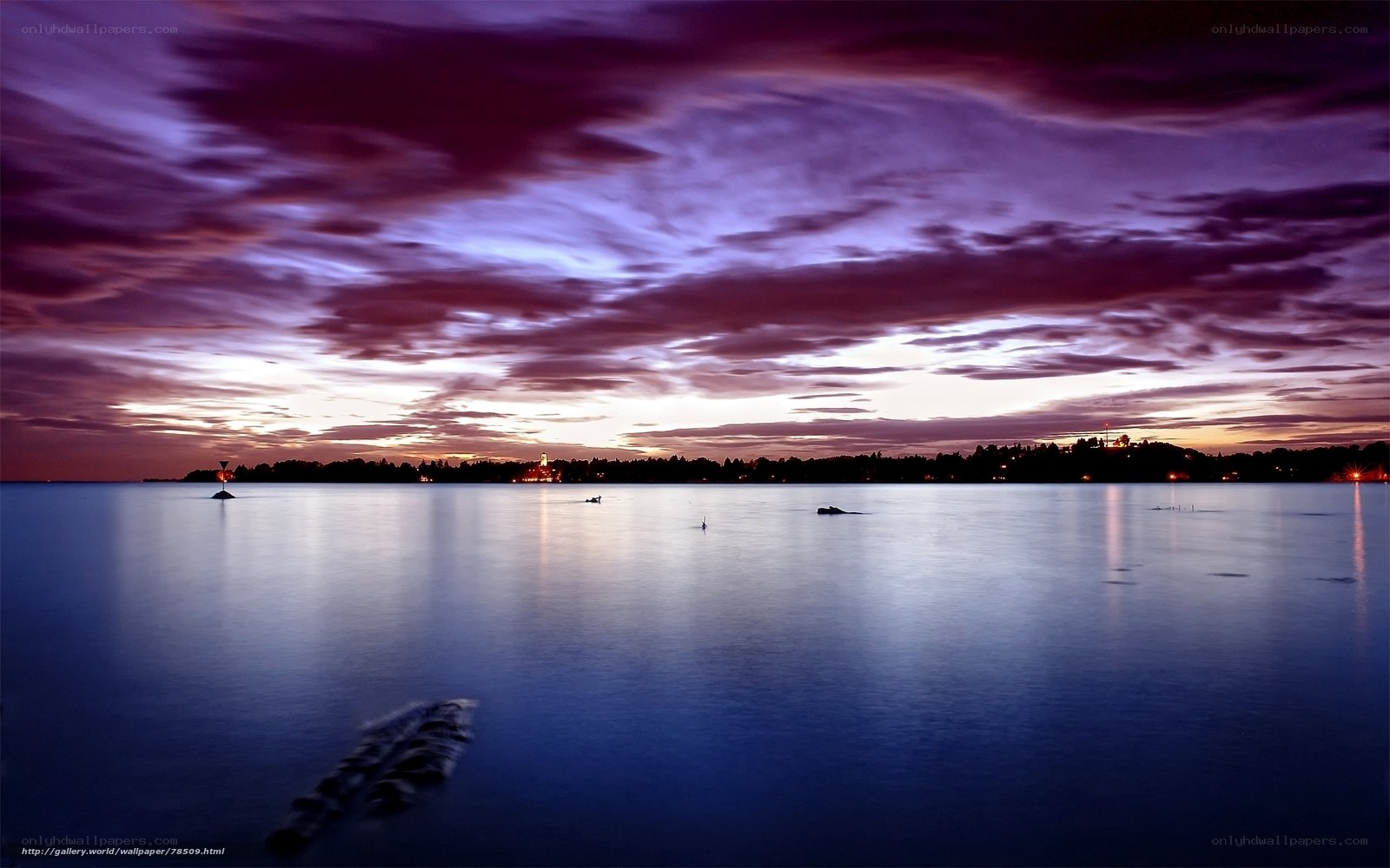 Purple sunset over calm water