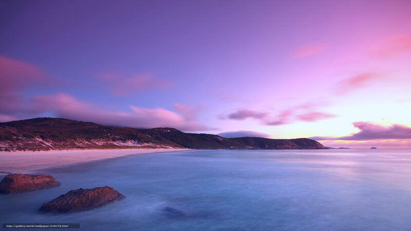 Purple sunset over coastal beach
