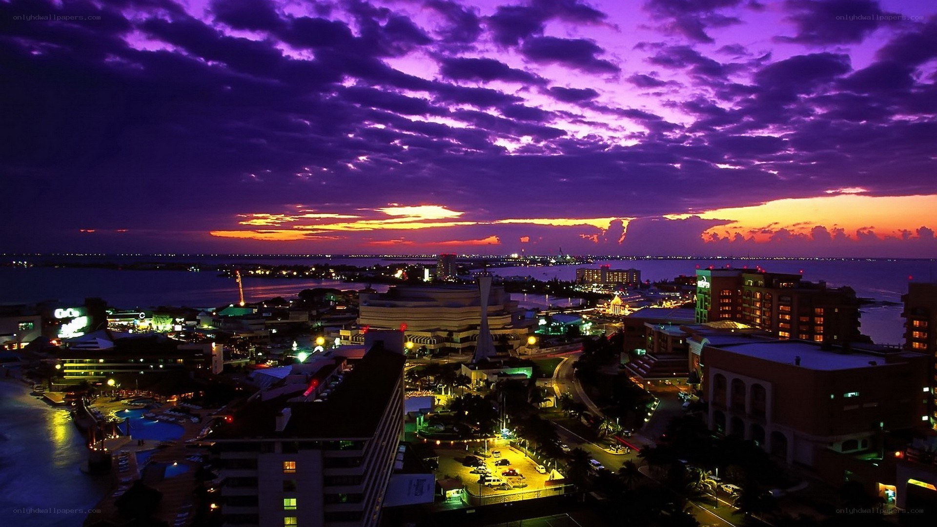 Purple sunset over coastal city