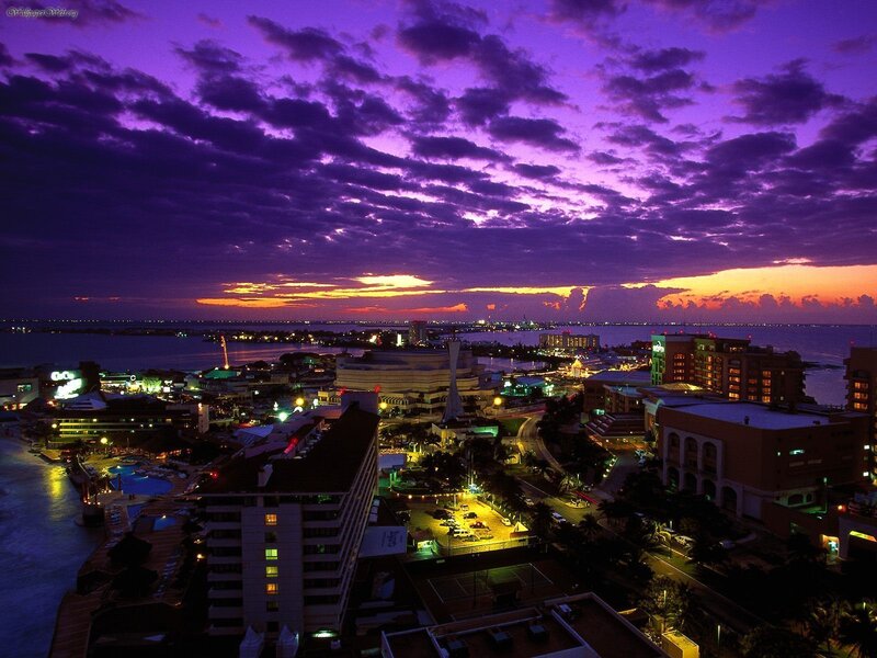 purple sunset over coastal city